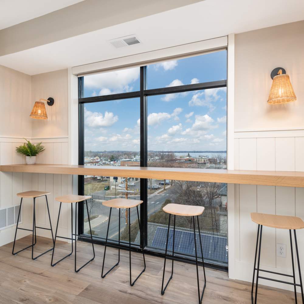 Communal bar with neighborhood view at The Uptown Apartments in Waconia, Minnesota
