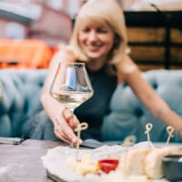 A woman holding a wine glass at Reagan Crossing in Covington, Louisiana