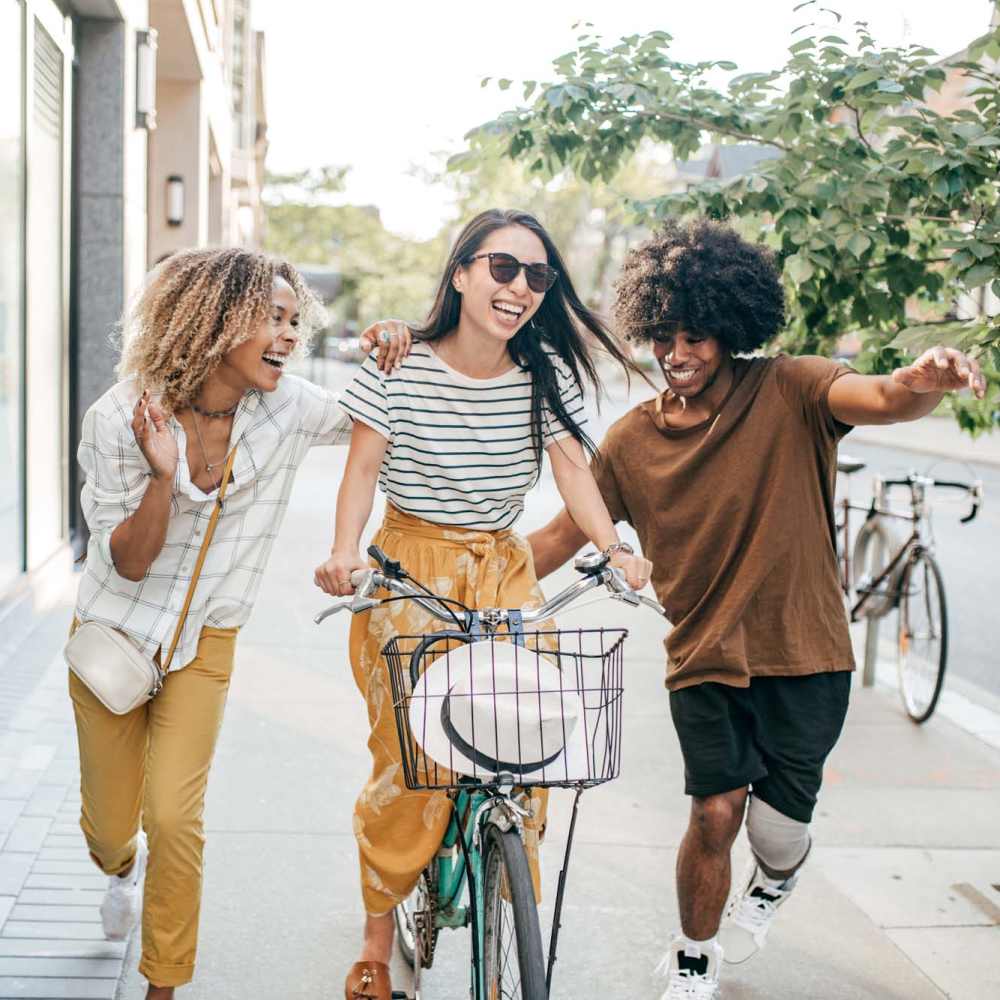 Friends exploring down the street at Flatiron West Trade in Charlotte, North Carolina