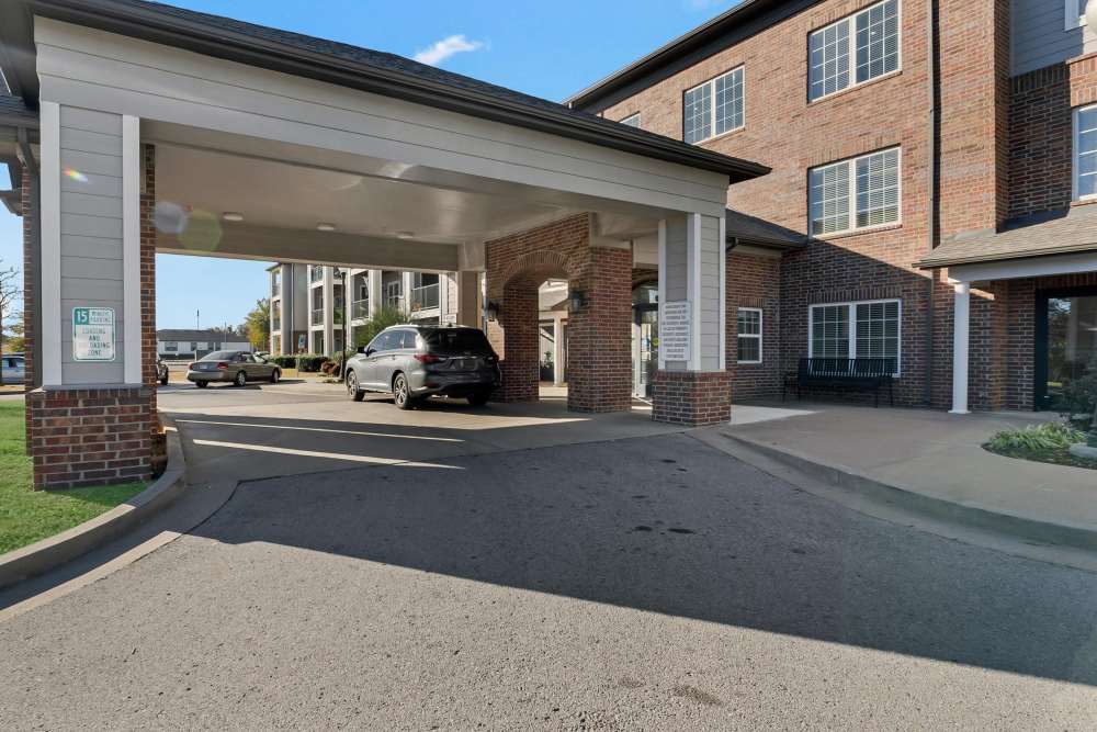 Exterior view of the community with parked car at River Ridge in Sand Springs, Oklahoma