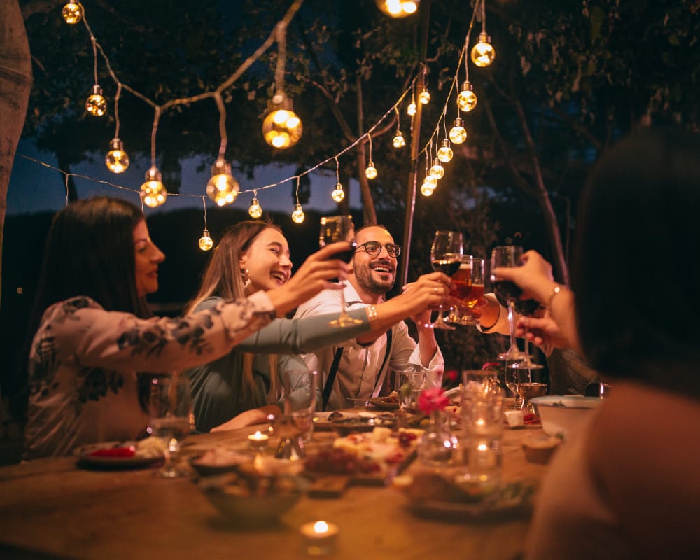 Friends enjoying dinner together near Rose Hill Estates in Norwich, Connecticut