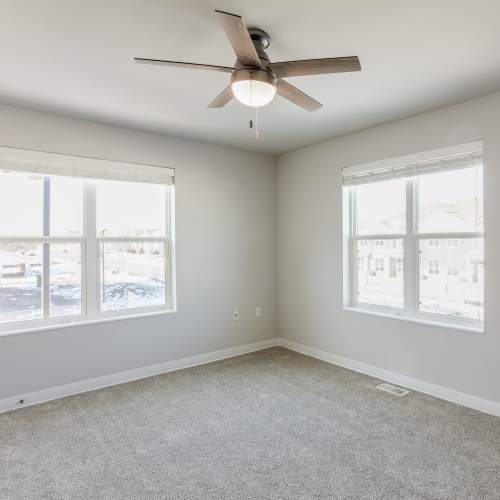 Unfurnished bedroom with ceiling fan at Union Court Senior Apartments and Townhomes in Kenosha, Wisconsin