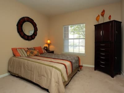 Well-lit bedroom at Harbin Pointe Apartments in Bentonville