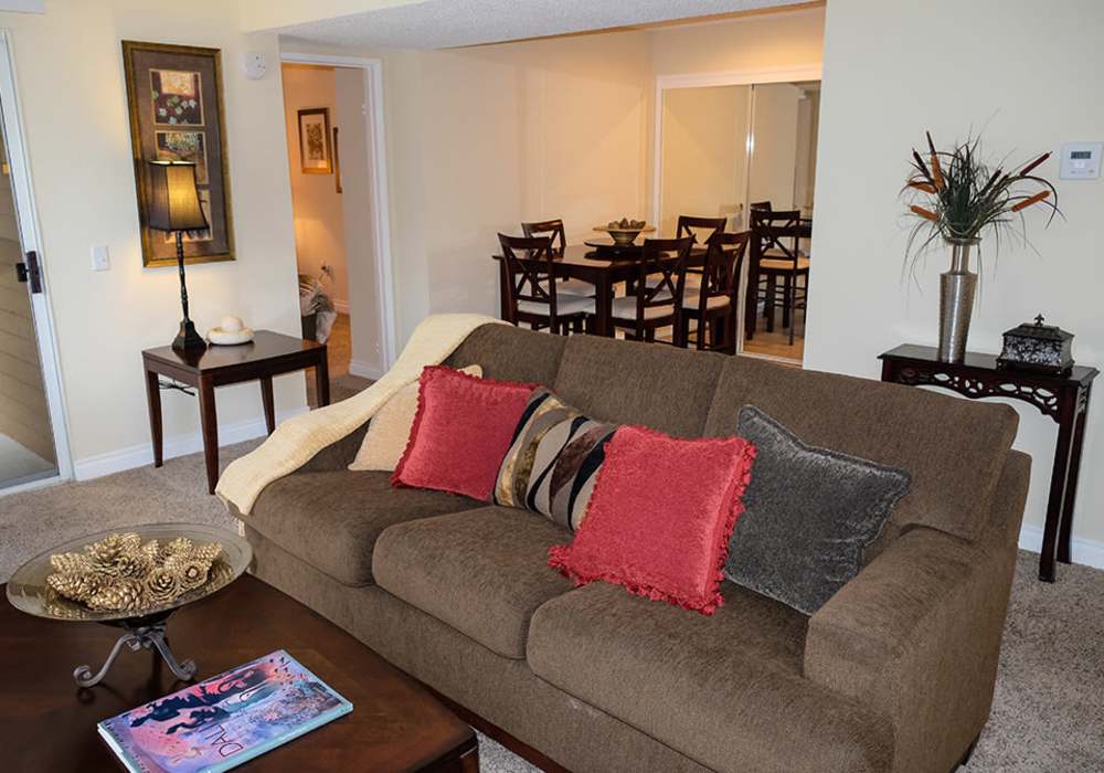 Living room with access to dining area at Shadowridge Summerwind in Vista. CA