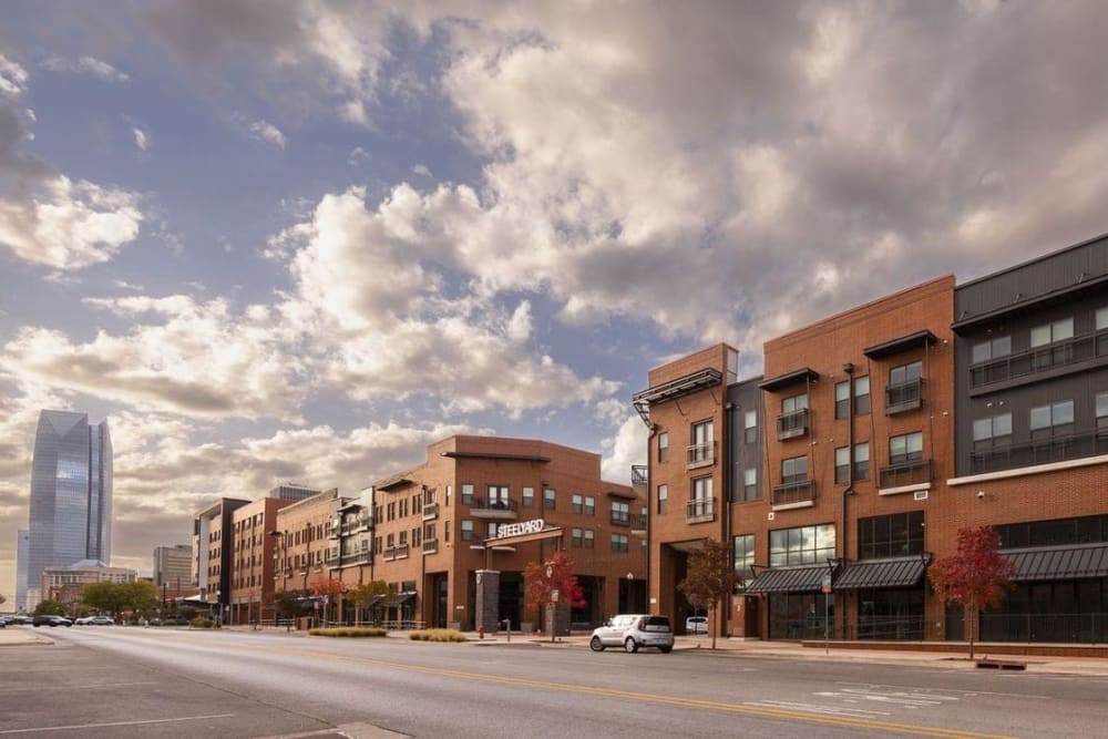 Streetview of Steelyard with high-rise buildings in the distance in Bricktown Oklahoma City, Oklahoma