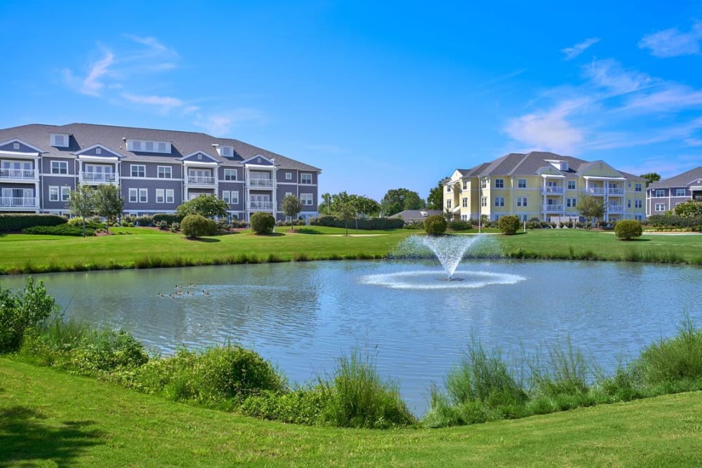 Beautiful lake with a fountain at The Apartments at Spence Crossing, Virginia Beach, Virginia