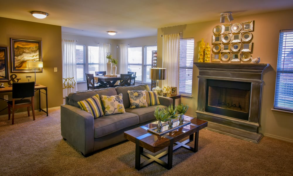 Spacious living room with plush carpeting at The Icon at Lubbock in Lubbock, Texas