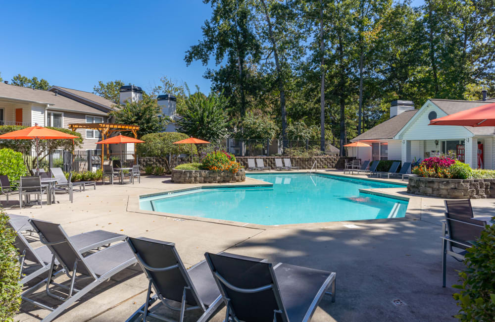 Lounge chairs by the swimming pool at The Hundred Exchange in Fayetteville, Georgia