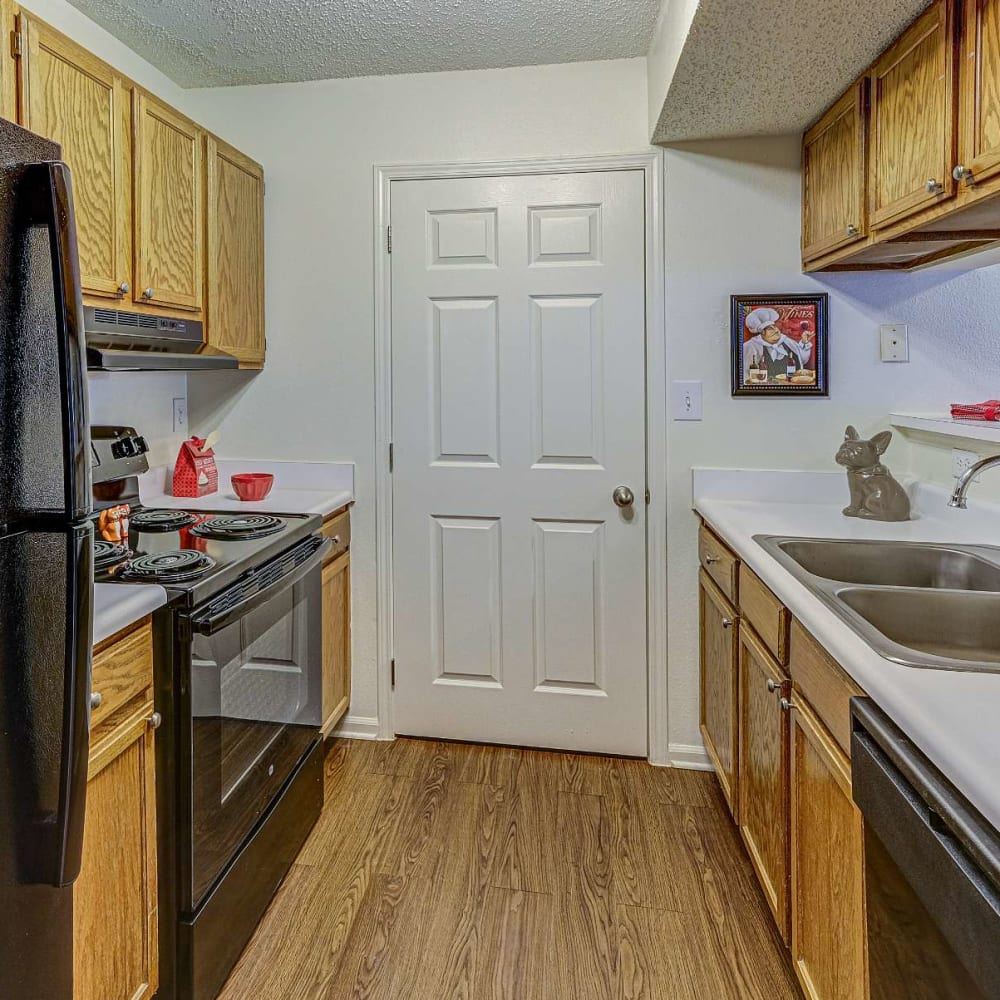 Open space kitchen with wood style flooring at Hunters Point in Zionsville, Indiana