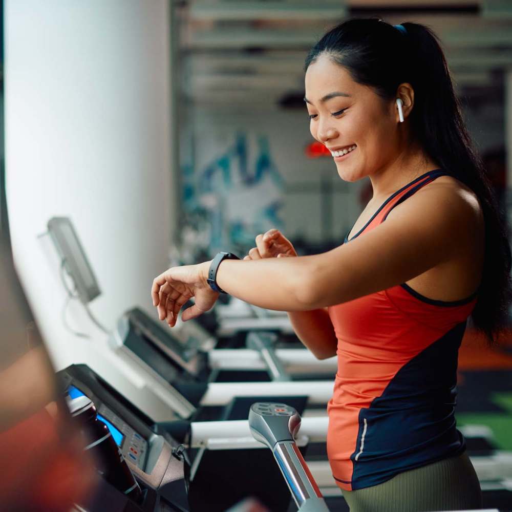 A woman working out on a treadmill at Alamar at Fernwood Forest in Indiantown,Florida