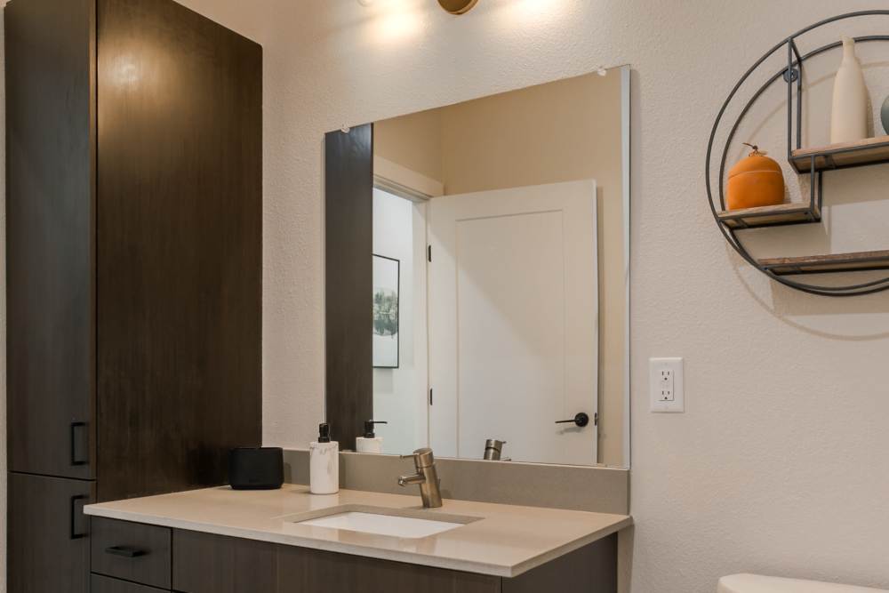 Washroom with mirror at Olympus Latitude in Albuquerque, New Mexico