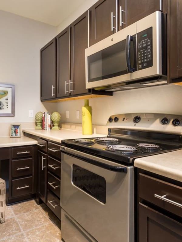 Kitchen with lots of cabinets and above stove built-in microwave at 29 North in Hickory, North Carolina