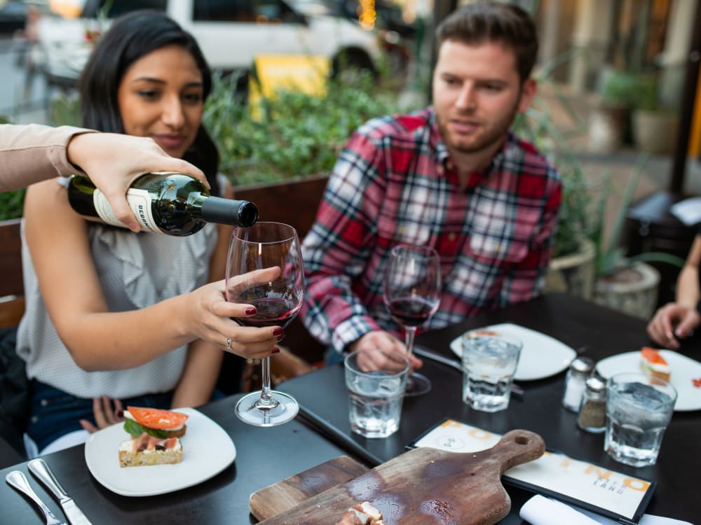 Residents enjoying wine and appetizers near Waterside at Ocotillo in Chandler, Arizona