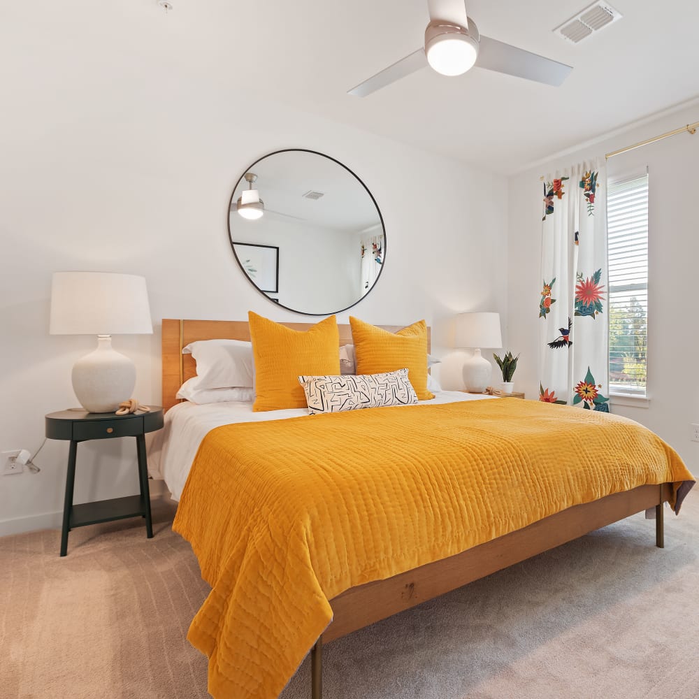 Well decorated bedroom with wood-style flooring at Archer at Brookhill in Charlottesville, Virginia