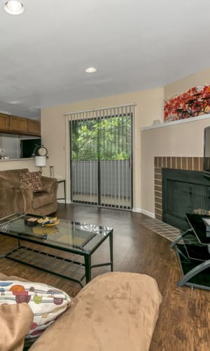 Apartment living room with fireplace at Pecan Ridge in Waco, Texas