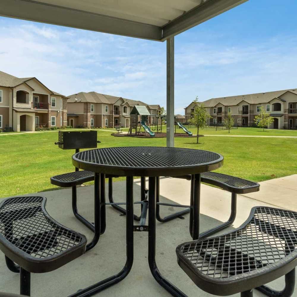 Outdoor grilling area and the seating space at Pine Creek in Paris, Texas