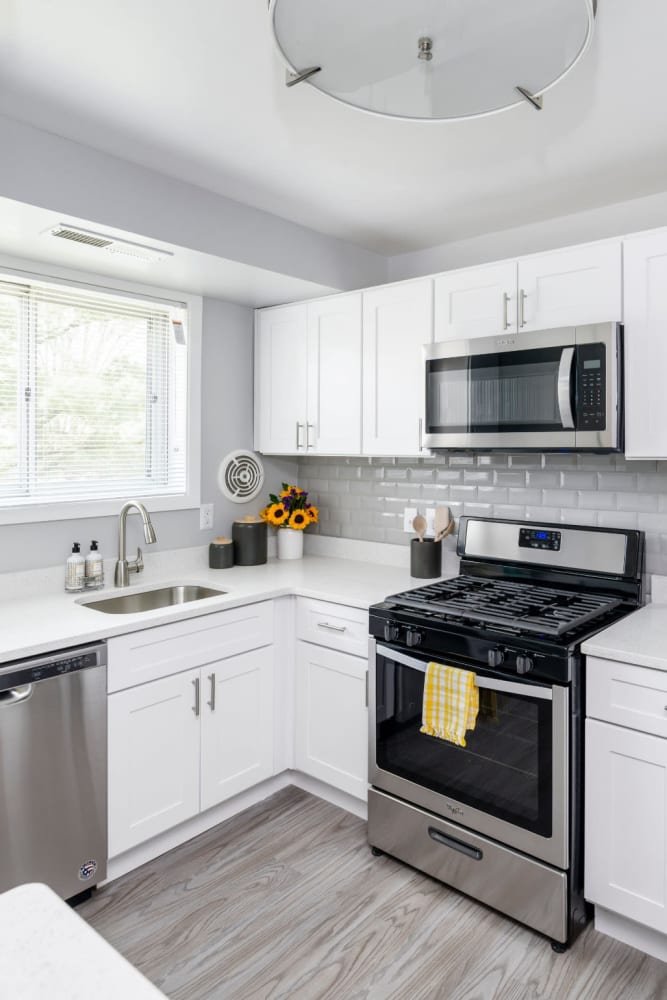 Modern kitchen with stainless-steel appliances at Beacon Hill Apartments in Alexandria, Virginia