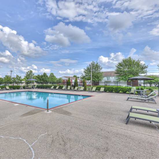 Resort-style swimming pool and lounge chairs for the community at Laurel Wood Apartments in Smyrna, Tennessee
