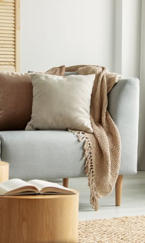 Model living room with neutral decor at Lofts at Pecan Ridge in Midlothian, Texas