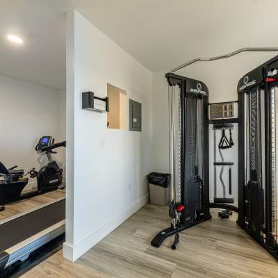 Resident cardio and resistance training in on site fitness room at Pinnacle Apartments in Fife, Washington