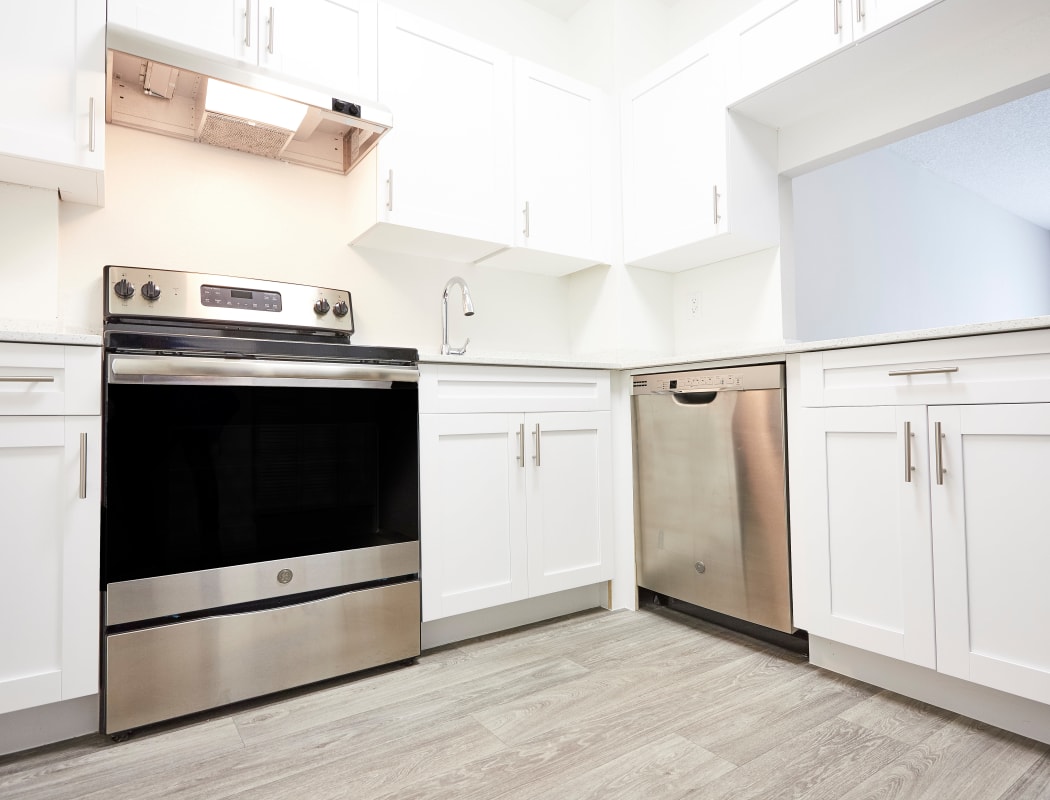 Open-concept floor plan with hardwood floors at Aliro in North Miami, Florida