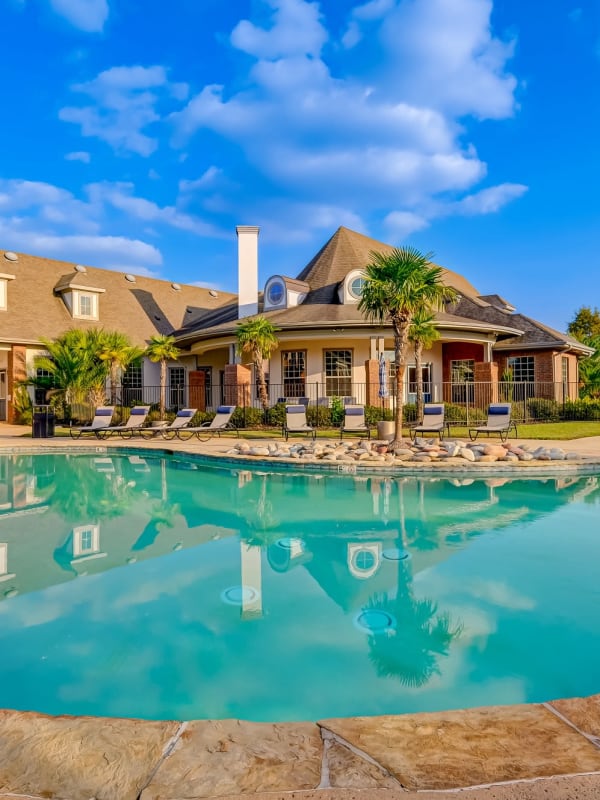 Sparkling swimming pool at Chateau Mirage Apartment Homes in Lafayette, Louisiana