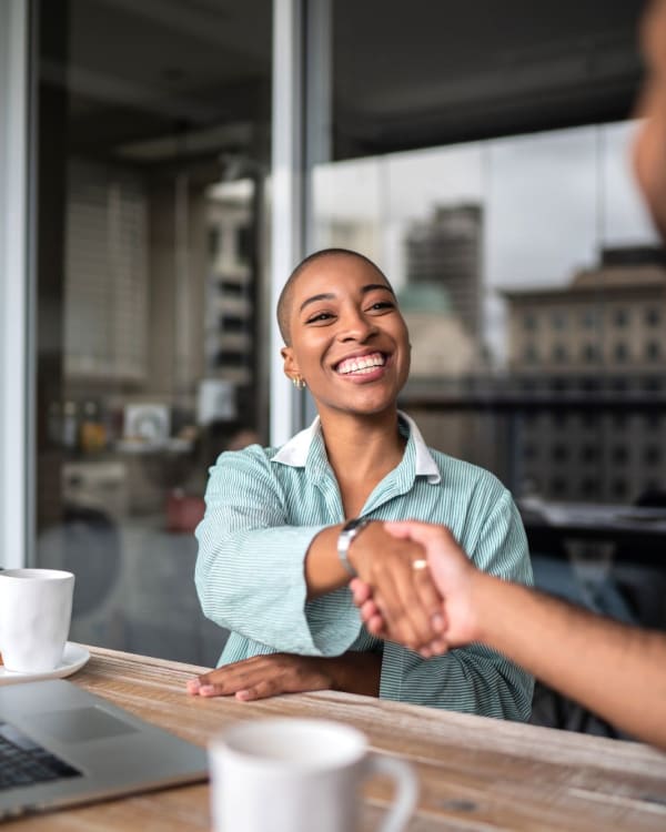 Resident smiling and shaking hands at Parallel 36 at Jailette in Atlanta, Georgia