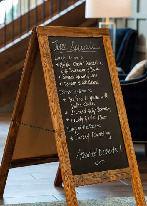 Dining menu on a chalkboard at The Pillars of Hermantown in Hermantown, Minnesota