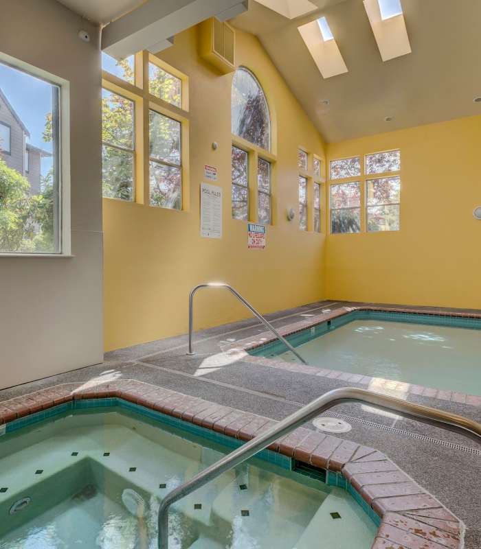 Indoor spa with view of pool at Foundry on Fifth in Renton, Washington