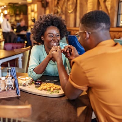 Couple enjoying a night out near Aston Pointe in Aston, Pennsylvania