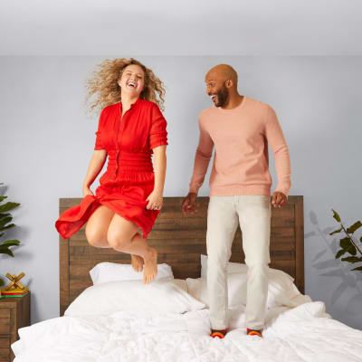 Two residents jumping on a bed at BB Living at Civic Square in Goodyear, Arizona