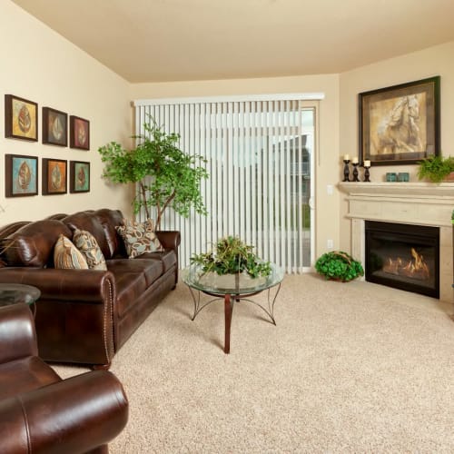 Living room with fireplace at The Preserve at Greenway Park in Casper, Wyoming