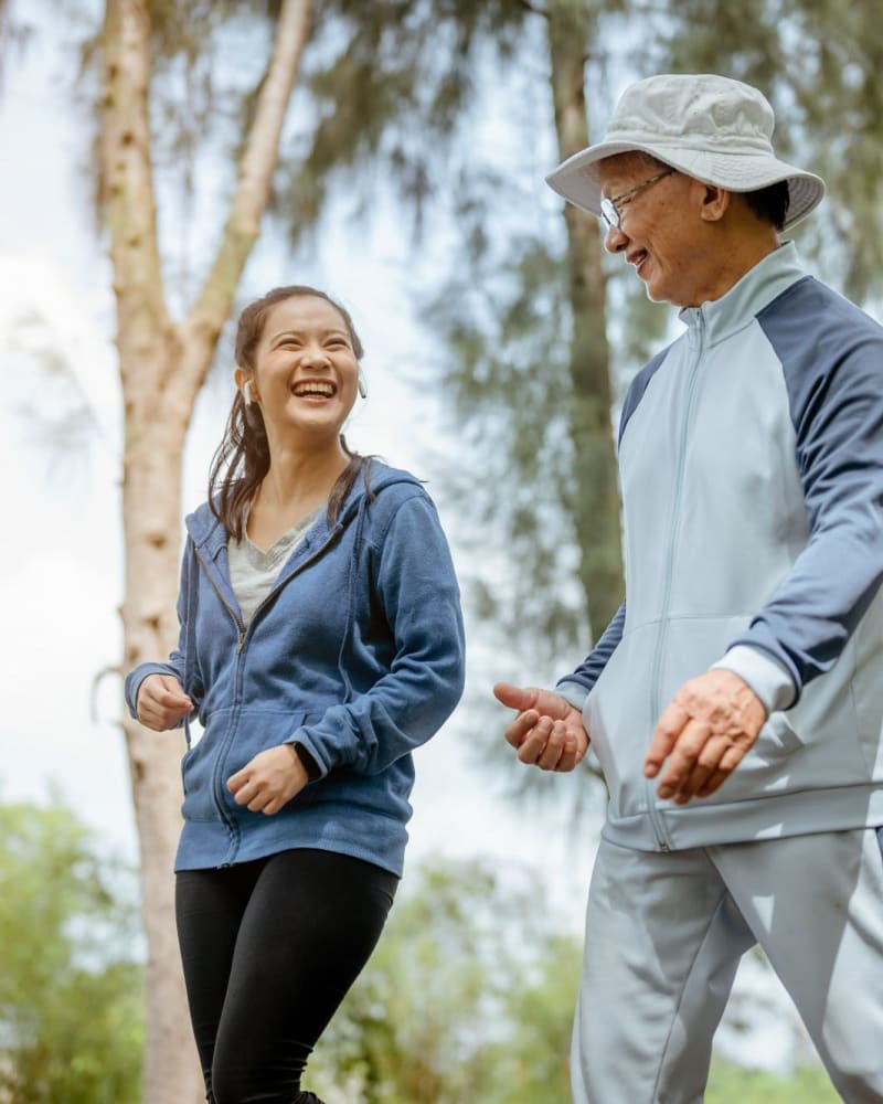 Residents enjoy a walk in the park near Willow Creek, San Jose, California