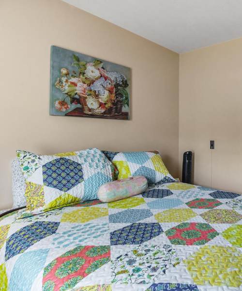 Beautiful bedroom at Tibbits Greene Senior Living in Coldwater, Michigan
