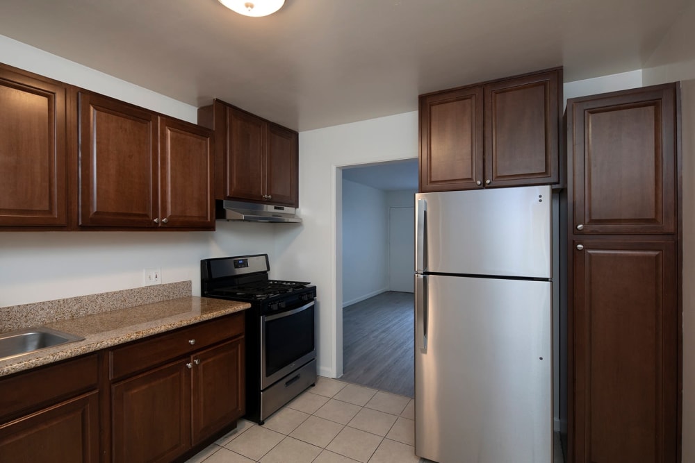 Upgraded kitchen with modern appliances at Ocean Palms Apartments in San Diego, California