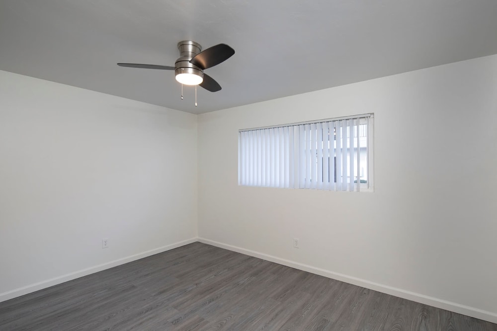 Updated bedrooms with ceiling fans at Ocean Palms Apartments in San Diego, California