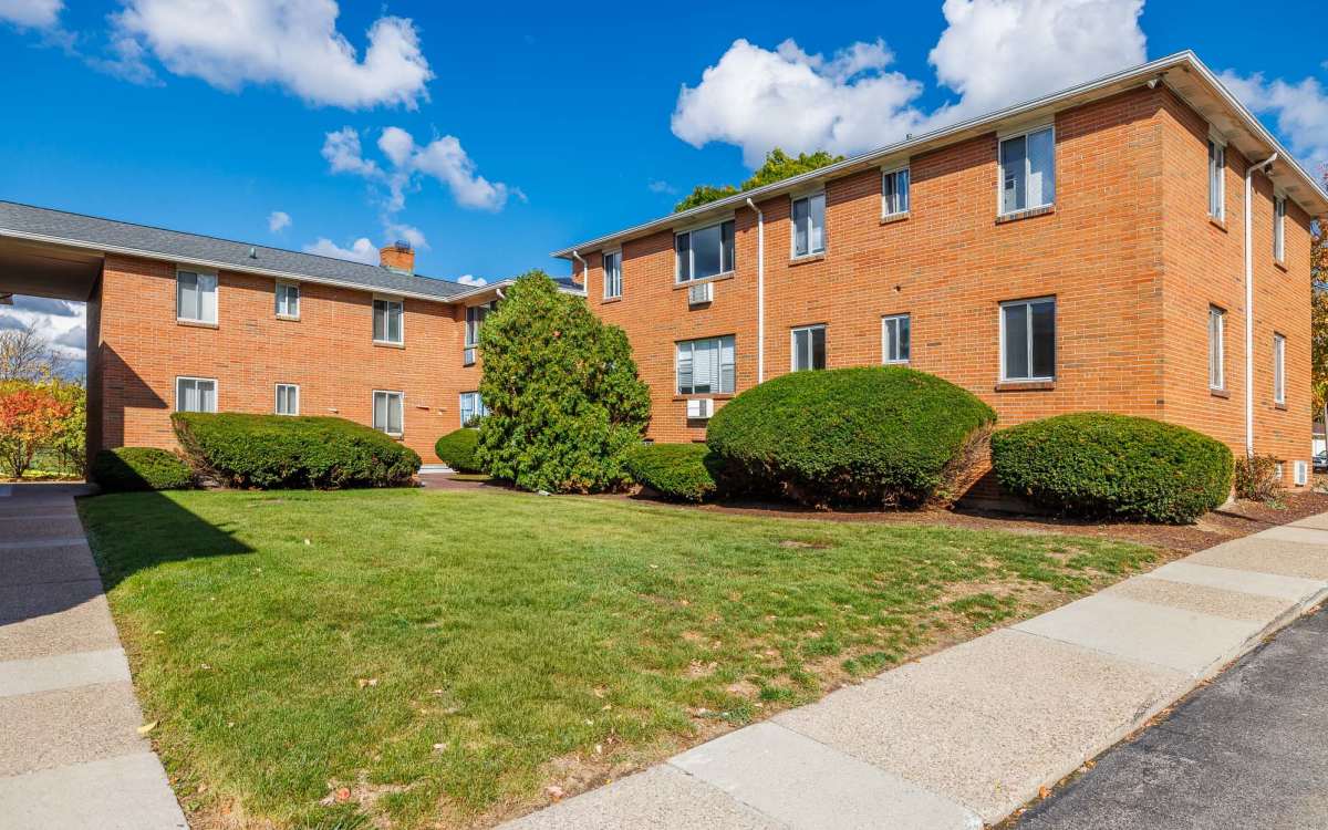 Beautiful view of the apartment exterior at Highland Bay Apartments in Rochester, New York