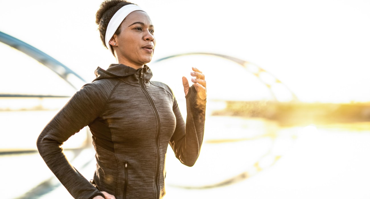 Woman out on a run in Collingswood, New Jersey near Marina Park Apartments