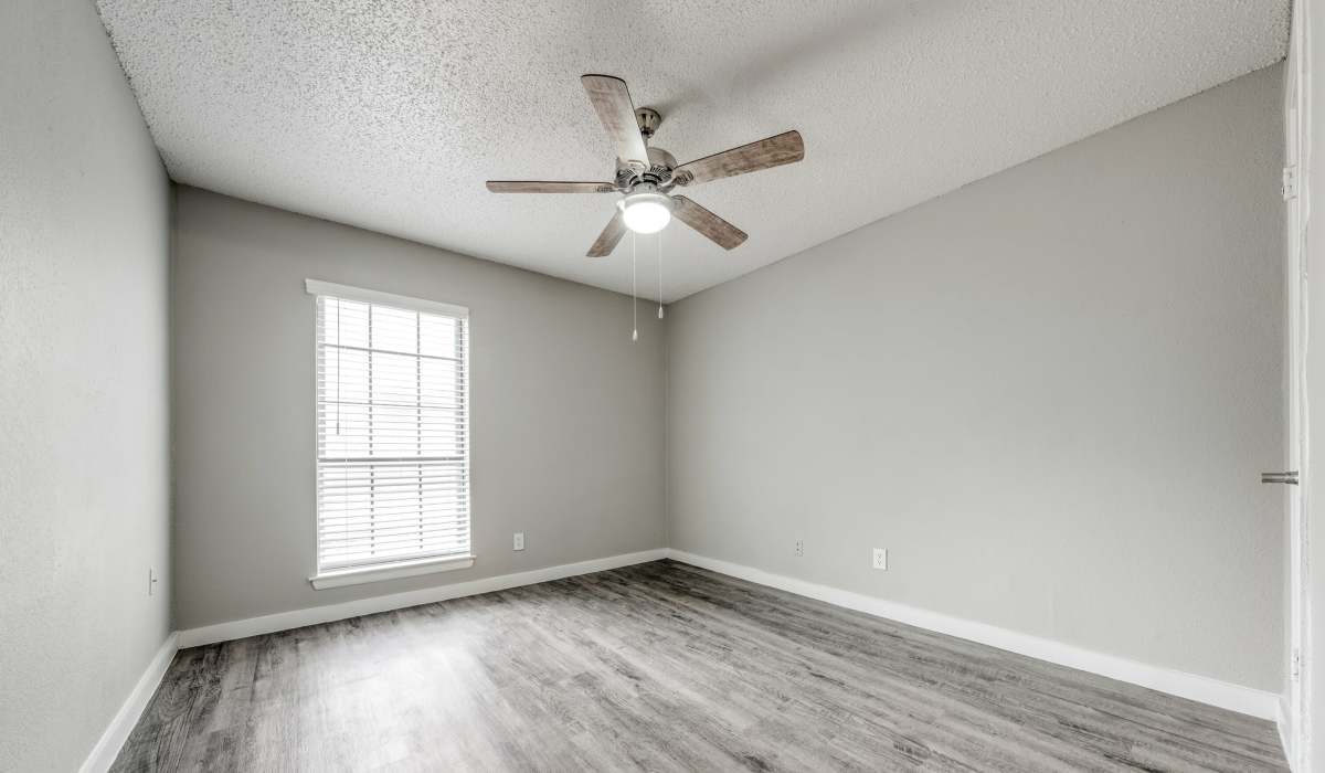 Spacious Bedroom with a ceiling fan at Icon Apartments in San Antonio, Texas