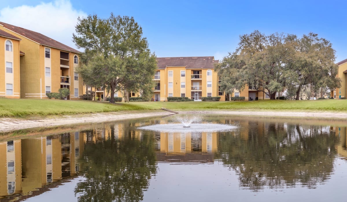 Lake with fountain outside of Images Condominiums in Kissimmee, Florida