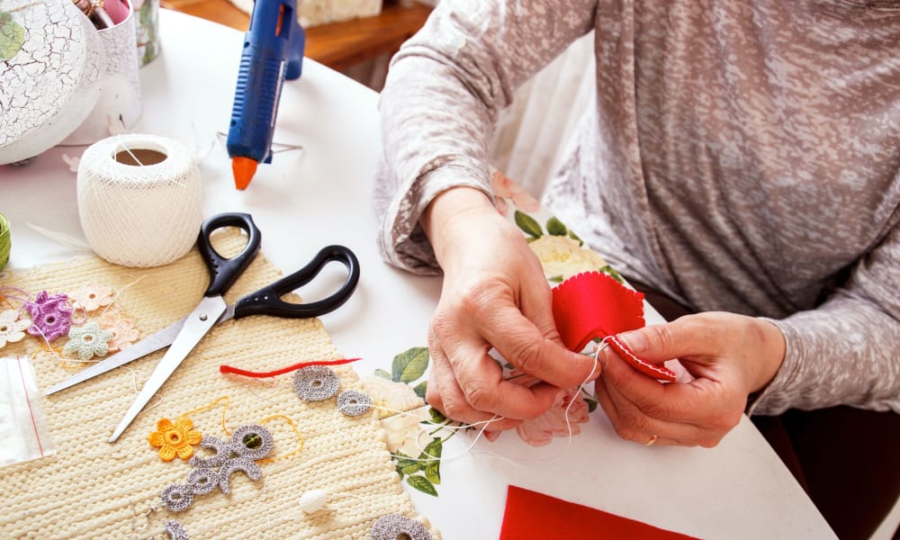 Resident working on arts & crafts at Randall Residence of Auburn Hills in Auburn Hills, Michigan
