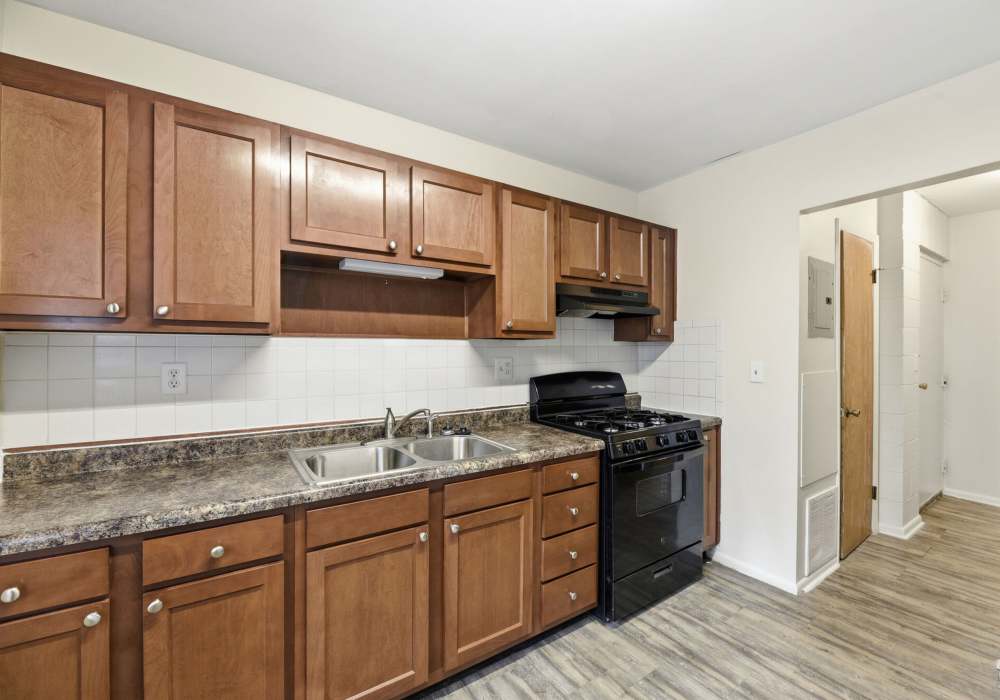 A kitchen featuring a cabinetry at Pin Oak Manor Apartments in Mishawaka, Indiana