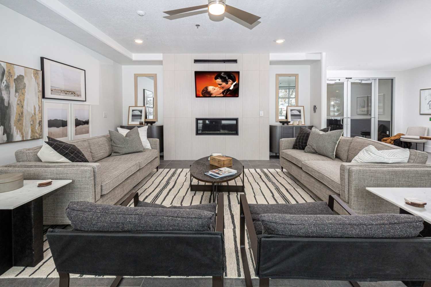 Lounge with kitchenette and large tv at The Hardison in Salt Lake City, Utah  