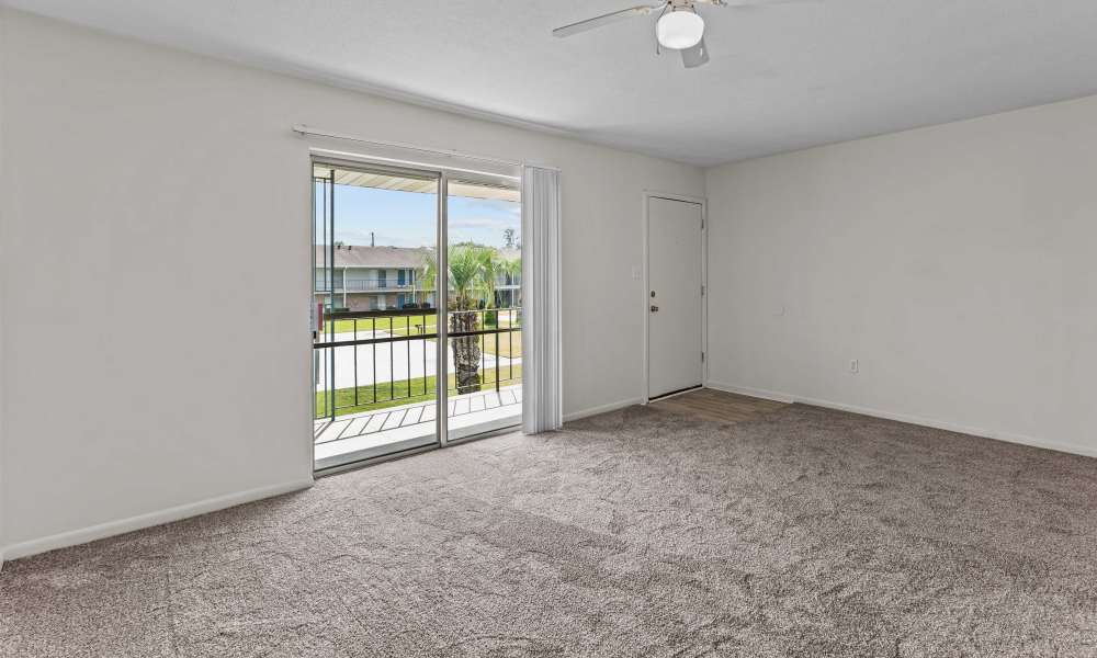 Living room with access to the private patio at Falcon House in Fort Walton Beach,Florida