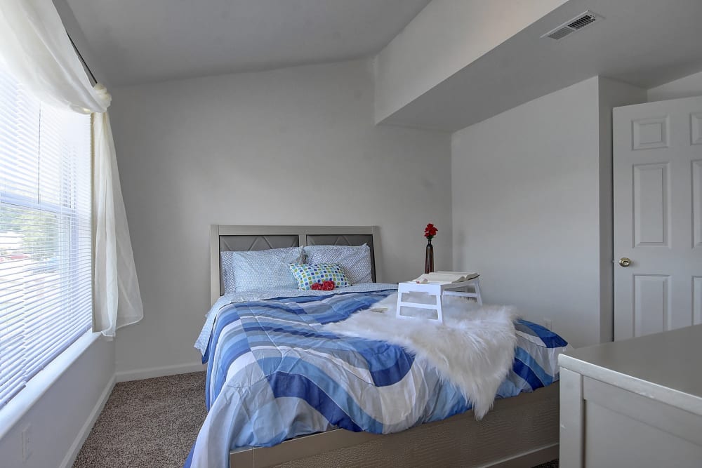 Master bedroom with large windows at Mariner's Watch in Norfolk, Virginia