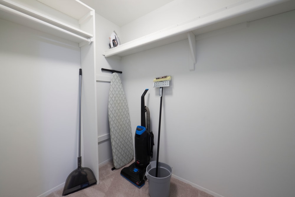 Large walk-in closet with cleaning supplies at Arbor Brook in Murfreesboro, Tennessee