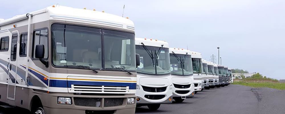 RVs parked in an organized row at Port Storage in Tillamook, Oregon