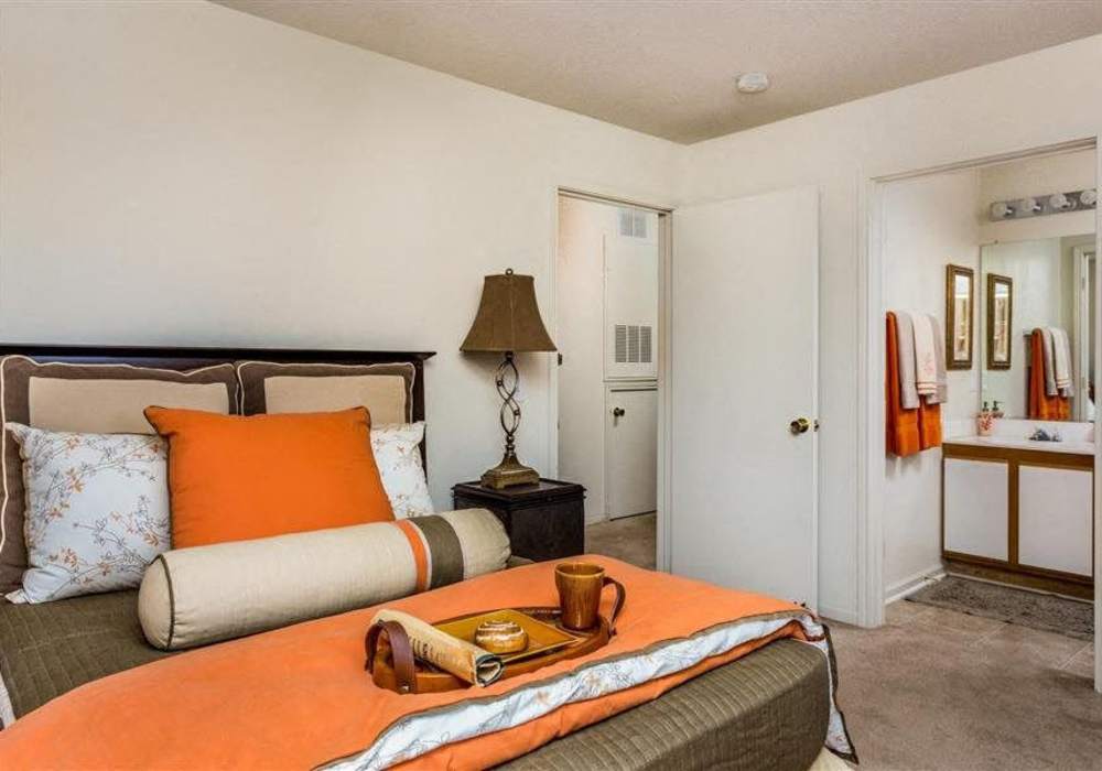 Spacious, carpeted bedroom at Hidden Creek Village in Fayetteville, North Carolina