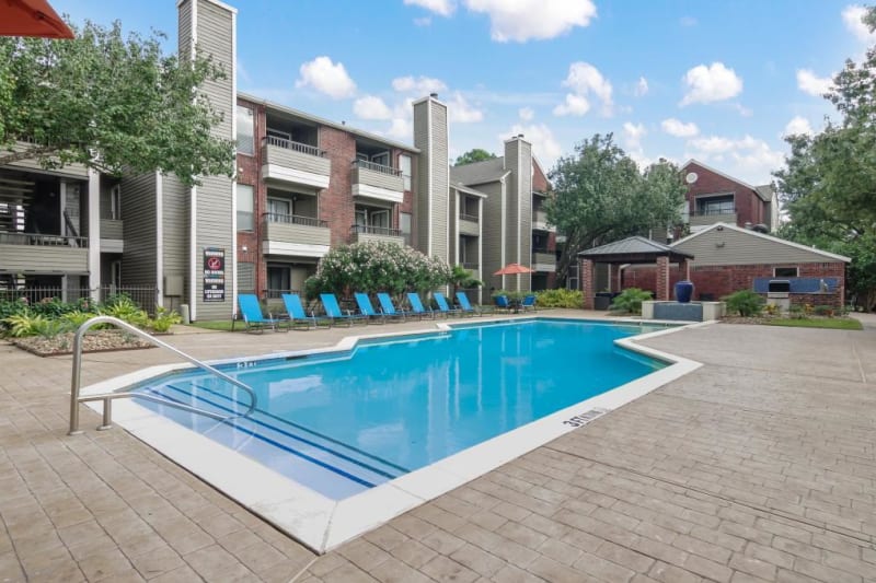 Relax by the outdoor pool at Circle at Point Park in Houston, Texas
