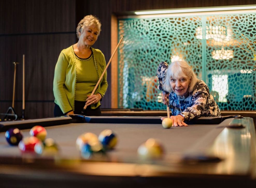 Residents playing pool at Murano in Seattle, Washington
